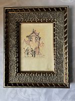 Front view of framed print showing artwork and ornate metal frame