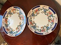 Both plates showing matching floral cobalt design