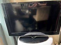 Front view of Samsung 32" LCD TV on pedestal stand