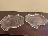 Two clear glass platters on table overview