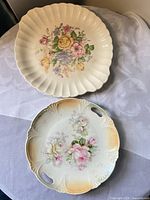 Two of the plates: fluted platter and handled cake plate, showing overall designs