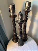 All three candle holders with candles displayed