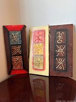 All three panels standing side by side showing colours and overall design