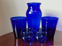 group shot showing all five cobalt blue glass pieces