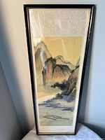 Front view of framed artwork showing image, matting and frame