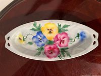 Top view showing floral design and handles