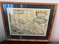 front view showing entire framed map under glass