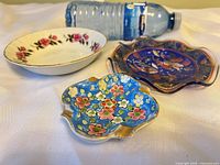 Overview of all three dishes with bottle for scale