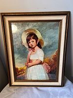 Front view of framed child portrait print