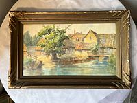 Full view of framed landscape painting