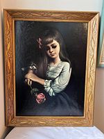 Front view showing entire framed portrait of girl with rose