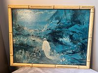 Front view of framed blue-toned painting