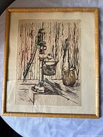 Frontal view of framed etching showing artwork, mat, and bamboo-style frame