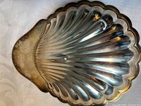 Top view of silverplate shell dish showing scalloped design
