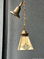 Pendant light full view showing chain, canopy and stained glass shade