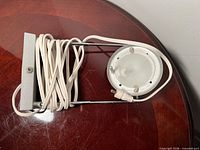 Full view of fixture coiled cord and bracket