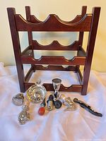 Front view of wood wine rack with all accessories displayed