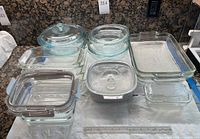 Full set laid out showing all bakeware and storage pieces