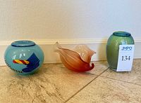 Front view of three art glass pieces