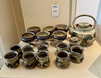 Full set showing teapot, lidded bowls, goblets, tumblers