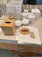 Group shot of marble and wood accessories on countertop