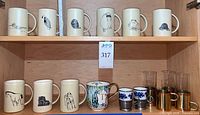 Full cabinet view showing all mugs, porcelain cup, demitasse and glass holders