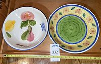 Top view of both bowls showing patterns and tape for scale