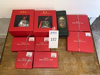 Nine red and green branded boxes on table