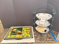 lot overview showing lemon cutting board, Curoc tray beneath, three-tier bowl stand with items inside