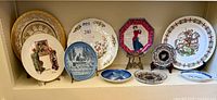 Group shot of all plates and dishes displayed on shelf