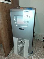 Front view of shredder showing Fellowes logo and manual