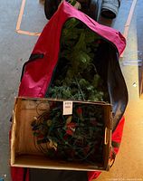 Tree sections and storage bag visible in open duffel