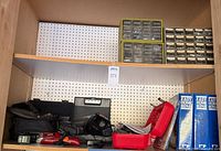 Shelf with drawer organizers, battery charger, vacuum, Weller case, binders and additional tools