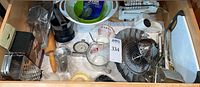 Drawer view showing full lot of kitchen utensils