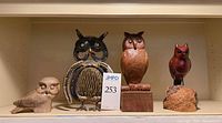 Front view showing all four owl figurines on shelf