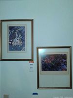 Both framed prints mounted on wall