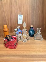 All bottles, wooden holder and pouch displayed together on shelf