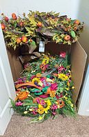 Box containing all four wreaths showing fall and summer designs together