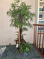 Full view of both faux plants showing relative sizes