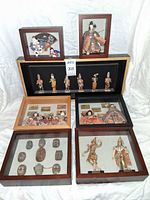 All six shadow boxes and open case shown together