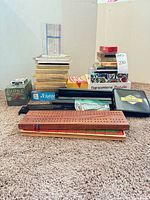 Group shot of all board games, cribbage boards, dominoes, Bridge sets and puzzle