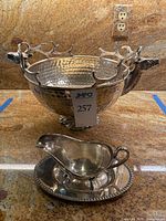 Hammered stainless steel bowl with stag head handles and gravy boat set