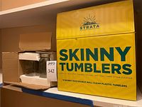 Strata box beside open box containing glass jars