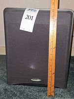 Front view of Velodyne subwoofer with ruler for scale