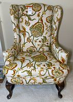 Front view wingback chair showing upholstery and legs