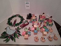 Overview of stained glass pieces, block bookends, car ornament, figurines