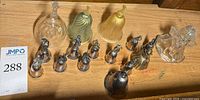 Full group of bells displayed on wood surface