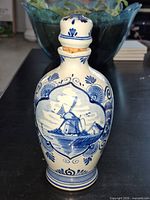 Front view showing windmill scene and stopper