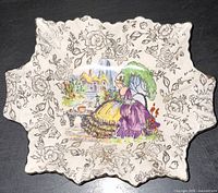 Top view showing Lavender Lady scene, floral chintz border and scalloped shape