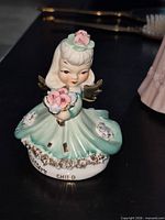 L'Amour China porcelain angel girl figurine, front view